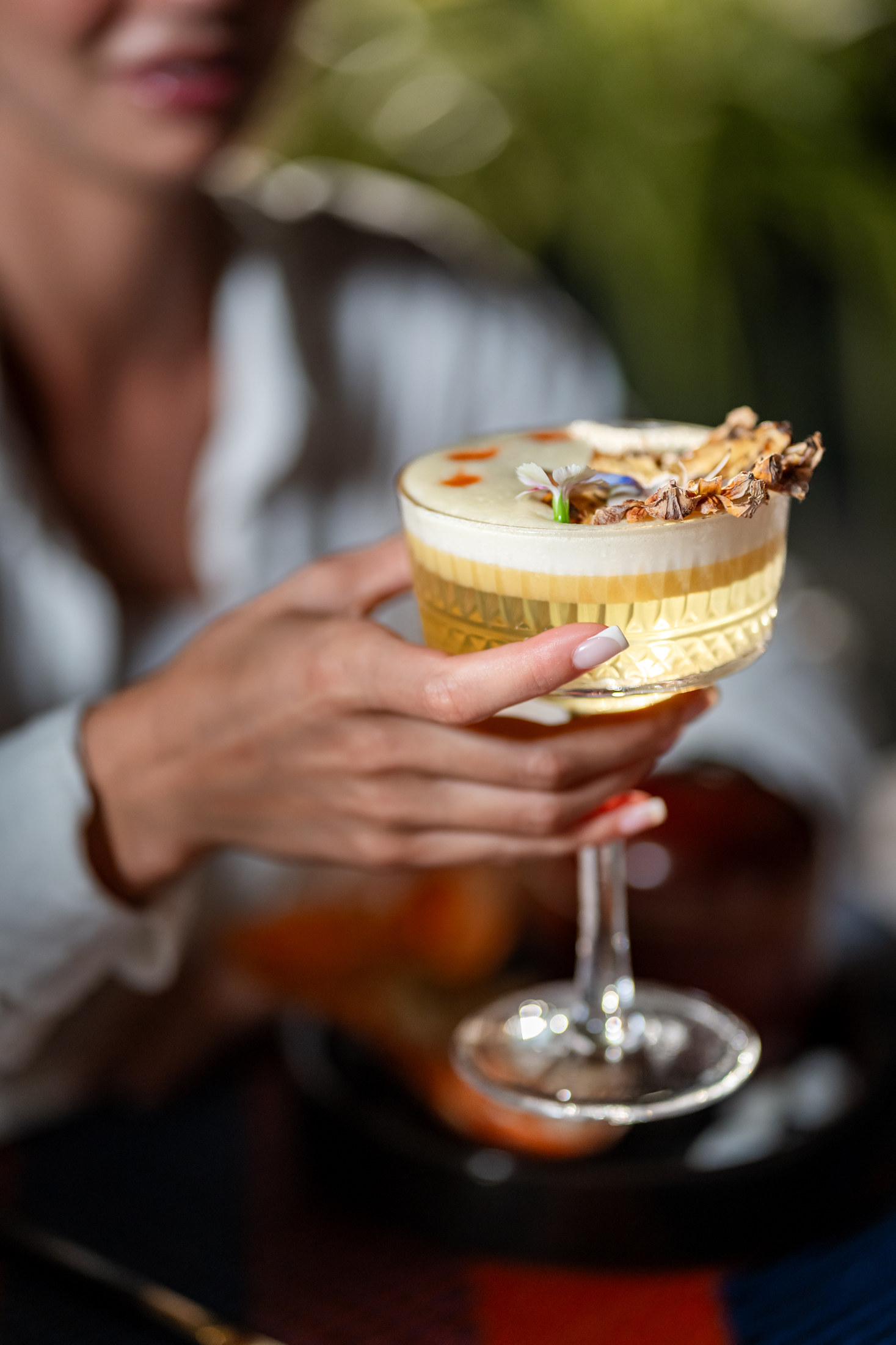 Guest holding a signature cocktail