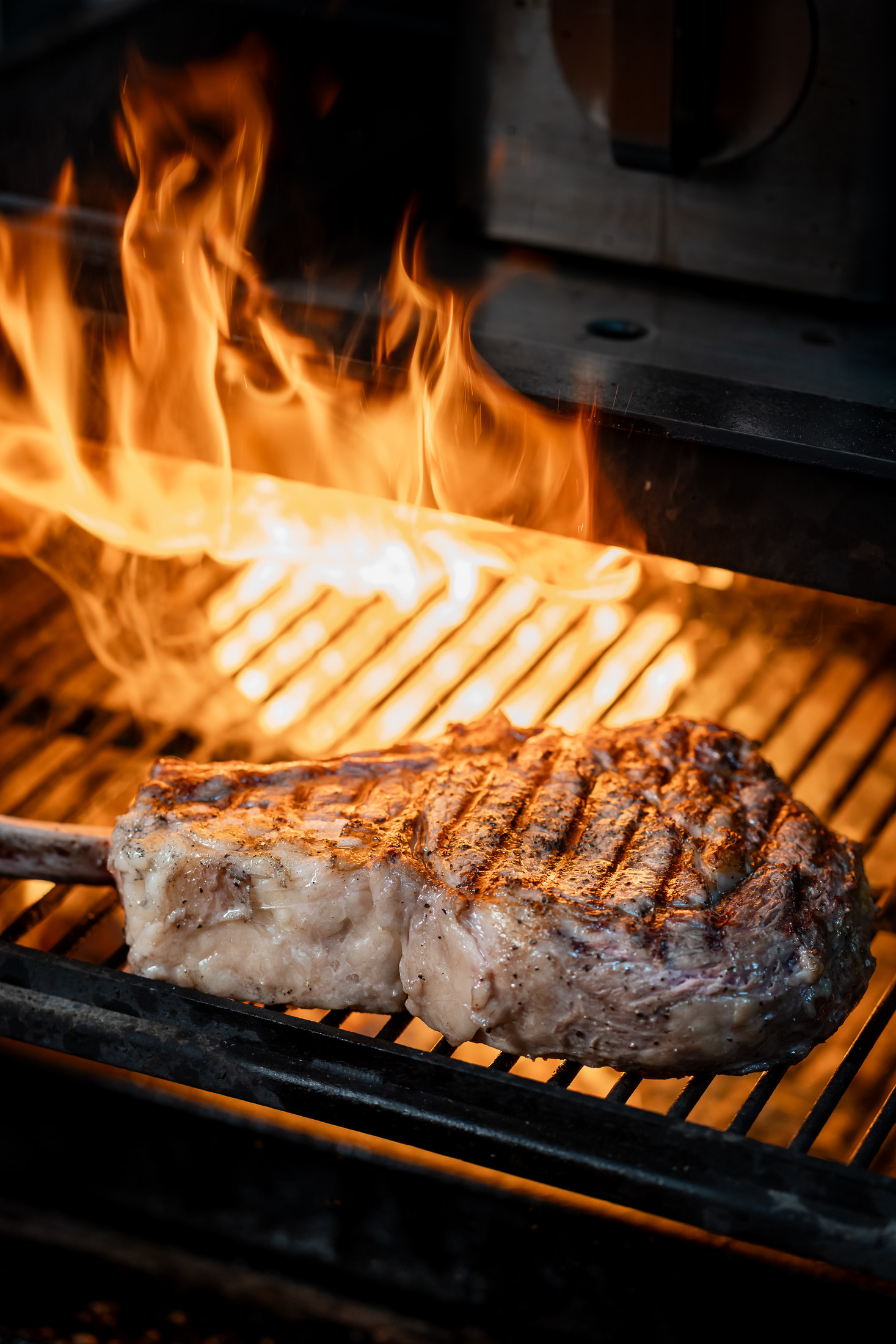 Steak searing over open flames